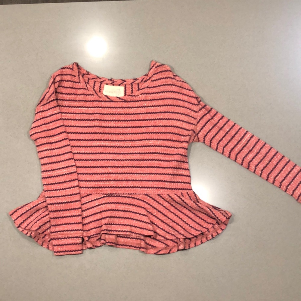 Long sleeve peplum shirt.